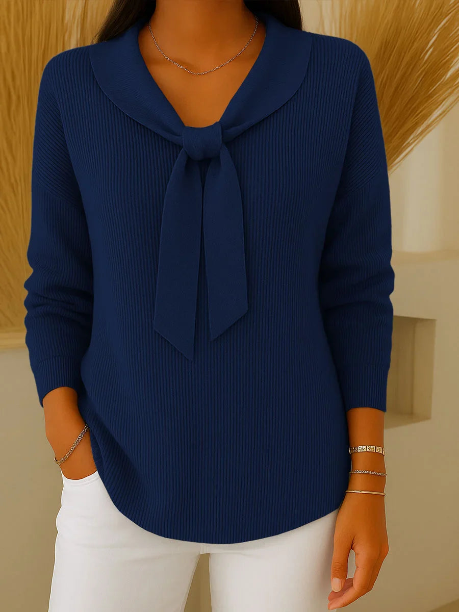 Women’s solid sweater with tie and long sleeves.